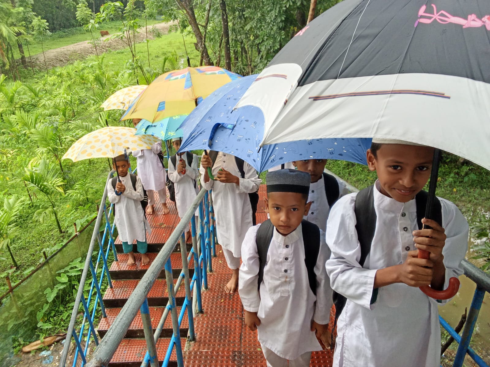 Students heading to class on a rainy morning